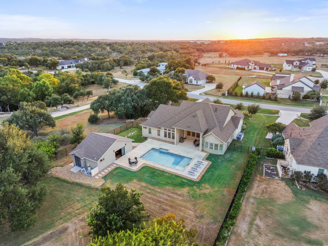 Sunset aerial view of the backyard, private pool and detached casita at 649 Bunker Ranch Blvd